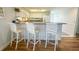 Kitchen features white cabinets, breakfast bar, and tile flooring at 7486 Palm Island Dr # 2422, Placida, FL 33946