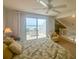 Bedroom with king bed, private deck access, and loft view at 7486 Palm Island Dr # 2422, Placida, FL 33946