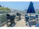 Outdoor grilling station with tables and chairs at 7486 Palm Island Dr # 2422, Placida, FL 33946