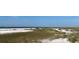 Scenic view of beach with sea oats at 7486 Palm Island Dr # 2422, Placida, FL 33946