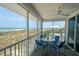 Spacious screened porch with outdoor seating and ocean views at 7486 Palm Island Dr # 2422, Placida, FL 33946