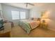 Bedroom with two twin beds, striped bedding, and ceiling fan at 7486 Palm Island Dr # 2422, Placida, FL 33946