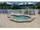 Octagonal hot tub surrounded by a brick patio at 7486 Palm Island Dr # 2422, Placida, FL 33946