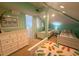 Upstairs bedroom with twin beds, dresser, and access to a shared bathroom at 7486 Palm Island Dr # 2422, Placida, FL 33946