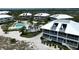 Aerial view of community pool and buildings at 7486 Palm Island Dr # 2422, Placida, FL 33946