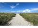 Sandy pathway leading to the beach at 7486 Palm Island Dr # 2422, Placida, FL 33946