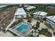 Aerial view of community with pool and tennis court at 7486 Palm Island Dr # 2422, Placida, FL 33946