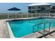 Inviting community pool with lounge chairs at 7486 Palm Island Dr # 2422, Placida, FL 33946