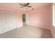 Spacious bedroom with ceiling fan and ample closet space at 4045 Country Meadows Blvd # 7, Punta Gorda, FL 33980