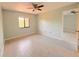 Spacious bedroom with ceiling fan and large window at 4045 Country Meadows Blvd # 7, Punta Gorda, FL 33980