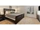 Main bedroom with king-size bed and dresser, offering comfort and style at 2955 N Beach Rd # A-415, Englewood, FL 34223