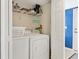 Convenient laundry closet with washer and dryer in unit at 2955 N Beach Rd # A-415, Englewood, FL 34223