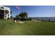 Relaxing community lawn with benches and grills overlooking the water at 2955 N Beach Rd # A-415, Englewood, FL 34223