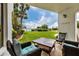 Relaxing patio overlooking a lush lawn and waterfront views at 2955 N Beach Rd # A-415, Englewood, FL 34223