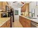 Well-equipped kitchen boasts granite countertops and ample wood cabinets at 2955 N Beach Rd # A-415, Englewood, FL 34223