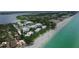 Aerial view of waterfront community with beach access and lush landscaping at 2955 N Beach Rd # A-415, Englewood, FL 34223