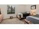 Guest bedroom with two twin beds, a dresser, and plenty of natural light at 2955 N Beach Rd # A-415, Englewood, FL 34223