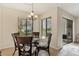 Casual dining area with glass table and wicker chairs, offering natural light at 2955 N Beach Rd # A-415, Englewood, FL 34223