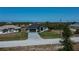 Property view showing house, driveway and street at 10401 Sunday Dr, Port Charlotte, FL 33981