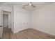 Bright bedroom featuring hardwood floors and built-in closet at 10401 Sunday Dr, Port Charlotte, FL 33981