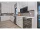 Modern kitchen with white cabinets, quartz countertops, and stainless steel appliances at 10401 Sunday Dr, Port Charlotte, FL 33981