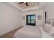 Bright bedroom with light flooring and sliding glass doors leading to patio at 10401 Sunday Dr, Port Charlotte, FL 33981