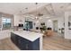 Open concept kitchen and living area with a large island and modern finishes at 10401 Sunday Dr, Port Charlotte, FL 33981