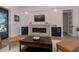 Living room featuring a modern fireplace and built-in shelving at 10401 Sunday Dr, Port Charlotte, FL 33981