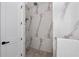 Large walk-in shower with marble tile and pebble flooring at 10401 Sunday Dr, Port Charlotte, FL 33981