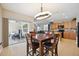 Bright dining room with sliding doors leading to the patio, and a chandelier at 15889 Viscount Cir, Port Charlotte, FL 33981