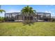Large backyard features a screened pool and plenty of space for outdoor fun at 15889 Viscount Cir, Port Charlotte, FL 33981