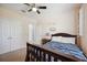 Bedroom with a ceiling fan and double doors at 15889 Viscount Cir, Port Charlotte, FL 33981