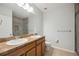 Double vanity bathroom with shower and tile flooring at 15889 Viscount Cir, Port Charlotte, FL 33981
