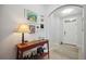 Bright and airy entryway with console table and artwork at 15889 Viscount Cir, Port Charlotte, FL 33981