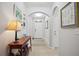 Bright and airy entryway with a console table and tasteful wall art at 15889 Viscount Cir, Port Charlotte, FL 33981