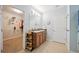 Double vanity bathroom with a walk-in closet at 15889 Viscount Cir, Port Charlotte, FL 33981