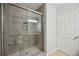 Walk-in shower with tile surround and built-in seat at 15889 Viscount Cir, Port Charlotte, FL 33981