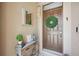 Inviting front entry with wreath and coastal decor at 15889 Viscount Cir, Port Charlotte, FL 33981