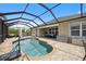 Enjoy this refreshing pool with a screened enclosure and plenty of patio space at 15889 Viscount Cir, Port Charlotte, FL 33981