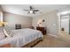 Bright bedroom with a ceiling fan and large bed at 15889 Viscount Cir, Port Charlotte, FL 33981
