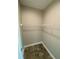 Spacious walk-in closet with wire shelving at 14364 Appleton Blvd, Port Charlotte, FL 33981