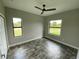 Bright bedroom with ceiling fan and tile flooring at 14364 Appleton Blvd, Port Charlotte, FL 33981