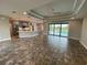 Open floor plan with kitchen, living area, and pool view at 14364 Appleton Blvd, Port Charlotte, FL 33981
