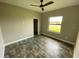 Bedroom with ceiling fan and large window at 14364 Appleton Blvd, Port Charlotte, FL 33981