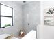 Spa-like bathroom with a freestanding tub and marble shower at 11042 Carnegie Ave, Englewood, FL 34224