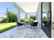 Relaxing patio with seating area and paver stones, ideal for outdoor enjoyment at 11042 Carnegie Ave, Englewood, FL 34224