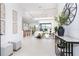 Open concept entryway offering a view of the living room and kitchen at 11042 Carnegie Ave, Englewood, FL 34224