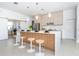 Modern kitchen with light cabinets and large island at 11042 Carnegie Ave, Englewood, FL 34224