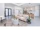 Open living room with modern kitchen and island visible in the background at 11042 Carnegie Ave, Englewood, FL 34224