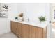 Double vanity with modern wood cabinets and quartz countertop at 11042 Carnegie Ave, Englewood, FL 34224